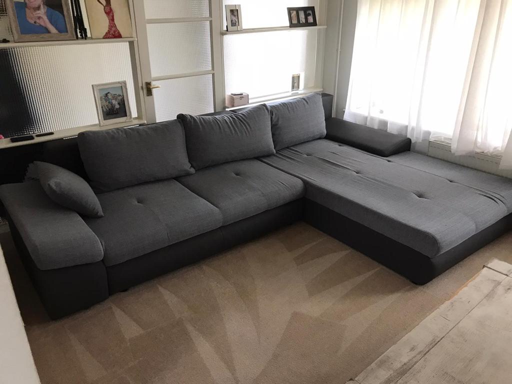 This is a photo of Penge Carpet Cleaning grey L shape sofa that has been professionally steam cleaned, also the beige carpets have been steam cleaned too.